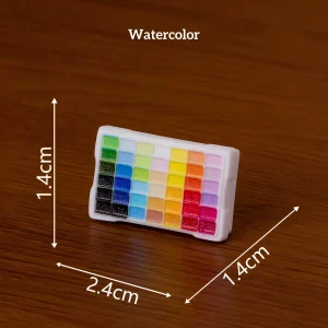 Watercolor paint palette grid, colorful miniature art supplies for artistic miniature display crafting
