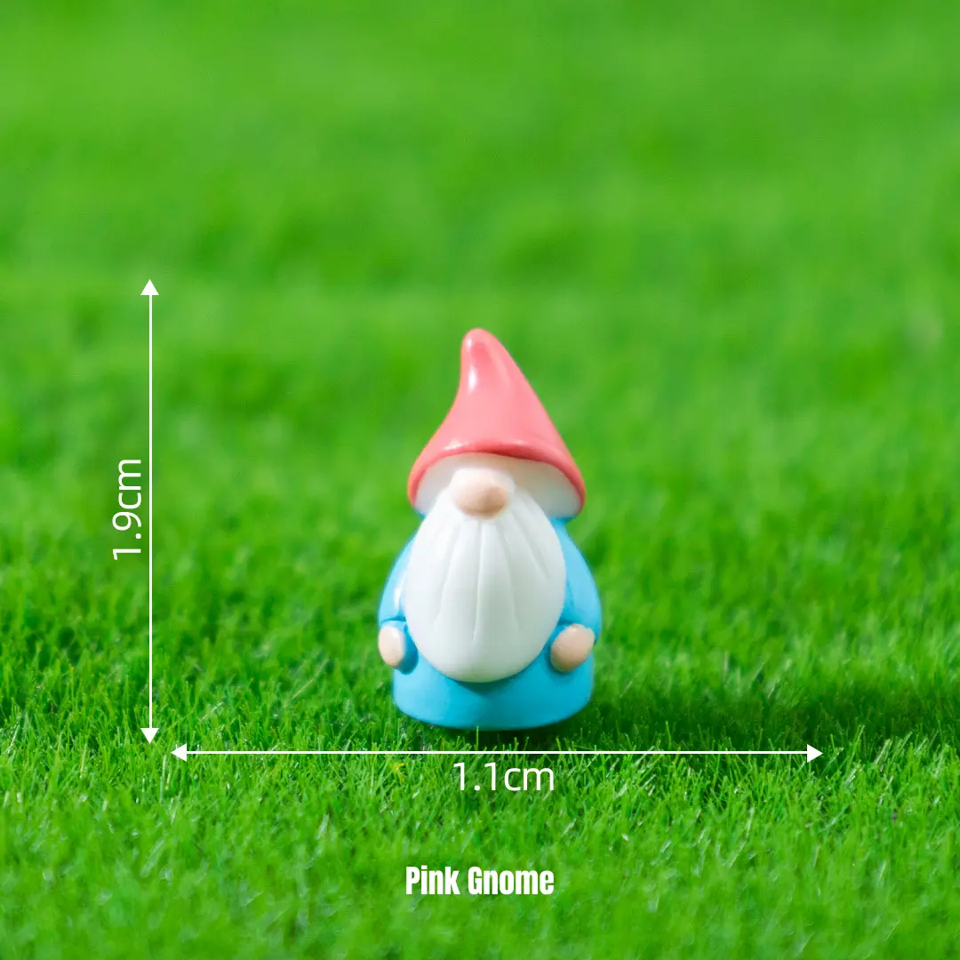 Cute gnome miniature decorations with pink cap on grass for themed miniature scene setups