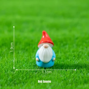 Classic red hat gnome miniature fairy characters on green lawn for storybook miniatures