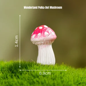 Red polka dot miniature mushrooms piece on green moss for fairy tale miniatures