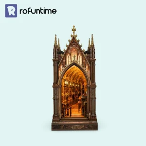 Aleph Library Book Nook kit featuring warm-lit Gothic architecture and miniature bookshelves